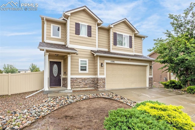 11081 Buckhead Pl, Fountain, CO 80817 - view of front of property featuring a garage, driveway, and stone siding
