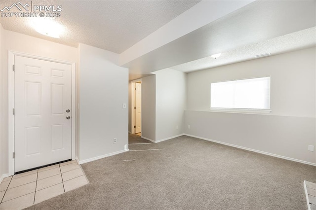 5805 Dutchess Dr, Colorado Springs, CO 80923 - unfurnished room featuring a textured ceiling, carpet, and baseboards