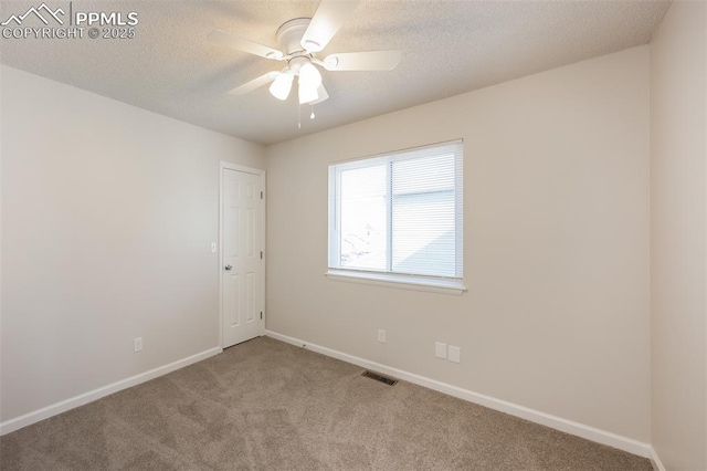 5805 Dutchess Dr, Colorado Springs, CO 80923 - spare room featuring carpet, baseboards, a ceiling fan, and a textured ceiling
