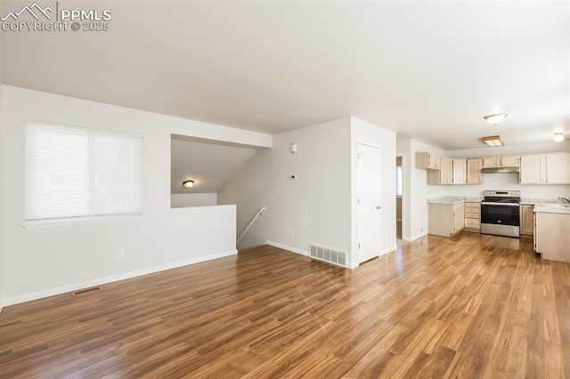 5805 Dutchess Dr, Colorado Springs, CO 80923 - unfurnished living room with baseboards and light wood-style floors