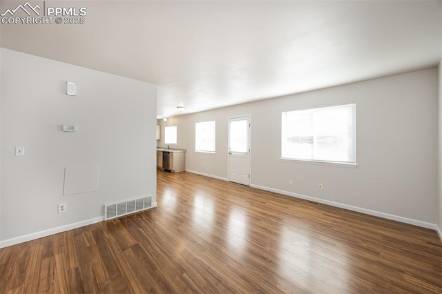 5805 Dutchess Dr, Colorado Springs, CO 80923 - unfurnished living room with baseboards and wood finished floors