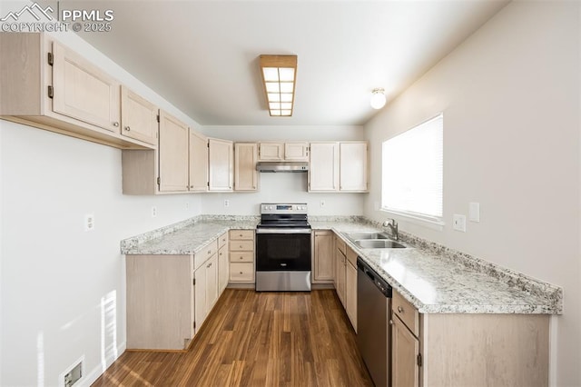 5805 Dutchess Dr, Colorado Springs, CO 80923 - kitchen featuring stainless steel appliances, a sink, under cabinet range hood, dark wood-style flooring, and light stone counters