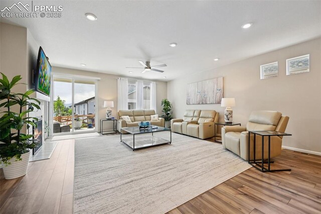 5932 Torrisdale Vw, Colorado Springs, CO 80927 - living room featuring wood finished floors, ceiling fan, recessed lighting, and baseboards