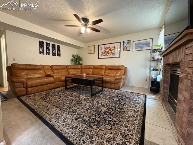 905 Hubbell Dr, Colorado Springs, CO 80911 - living area with ceiling fan, a textured ceiling, and a fireplace