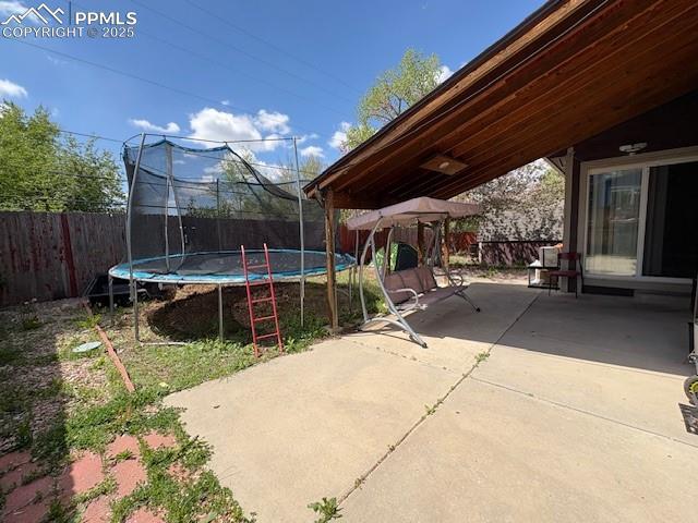 905 Hubbell Dr, Colorado Springs, CO 80911 - view of patio / terrace featuring a trampoline, a fenced backyard, and a gazebo