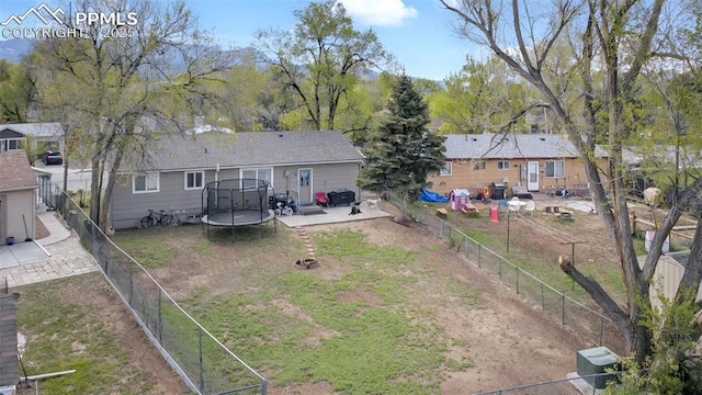 1033 Mt Werner Cir, Colorado Springs, CO 80905 - back of house featuring a trampoline and a patio