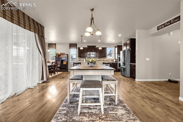 10282 Mt Lincoln Dr, Peyton, CO 80831 - dining area with baseboards and wood finished floors