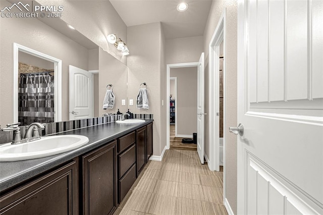 10282 Mt Lincoln Dr, Peyton, CO 80831 - full bath featuring double vanity, baseboards, and a shower with curtain