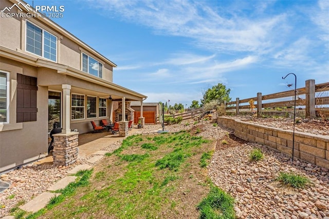10282 Mt Lincoln Dr, Peyton, CO 80831 - fenced backyard with a patio area