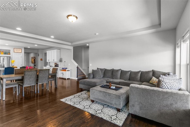 8674 Tranquil Knoll Ln, Colorado Springs, CO 80927 - living area with a tray ceiling, dark wood-style floors, stairs, recessed lighting, and baseboards