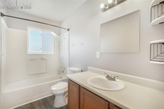 1223 Soaring Eagle Dr, Colorado Springs, CO 80915 - bathroom with toilet, vanity, wood finished floors, and shower / tub combination