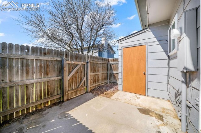 1223 Soaring Eagle Dr, Colorado Springs, CO 80915 - view of patio featuring fence and a gate