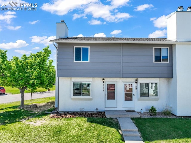 1223 Soaring Eagle Dr, Colorado Springs, CO 80915 - view of front facade with a chimney, a front lawn, and crawl space