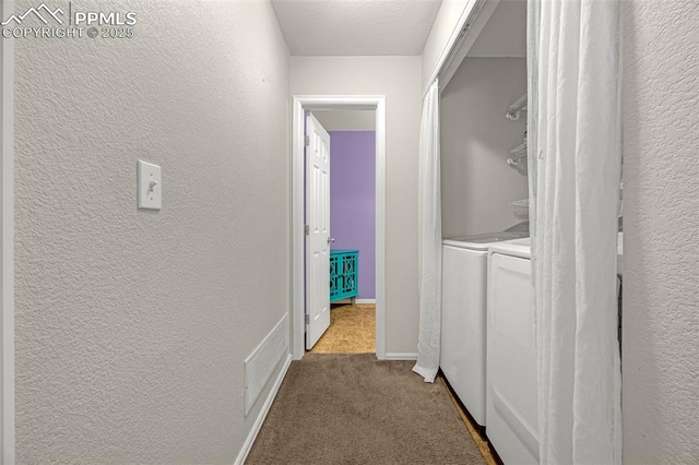 8290 Meadowcrest Dr, Fountain, CO 80817 - corridor with washing machine and clothes dryer, dark carpet, a textured wall, and baseboards