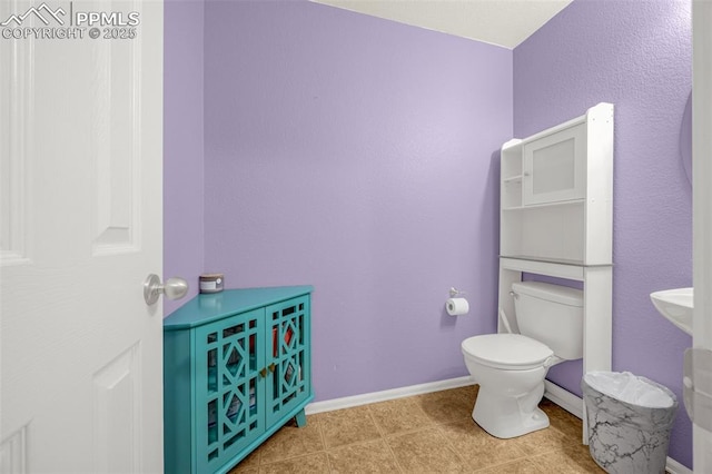 8290 Meadowcrest Dr, Fountain, CO 80817 - bathroom featuring toilet and baseboards