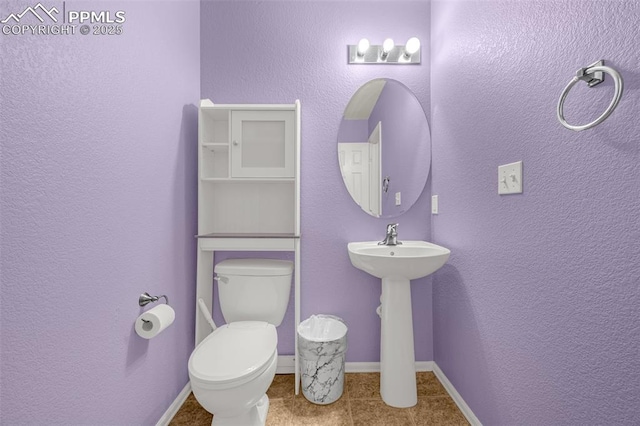 8290 Meadowcrest Dr, Fountain, CO 80817 - half bathroom featuring toilet, baseboards, and tile patterned floors