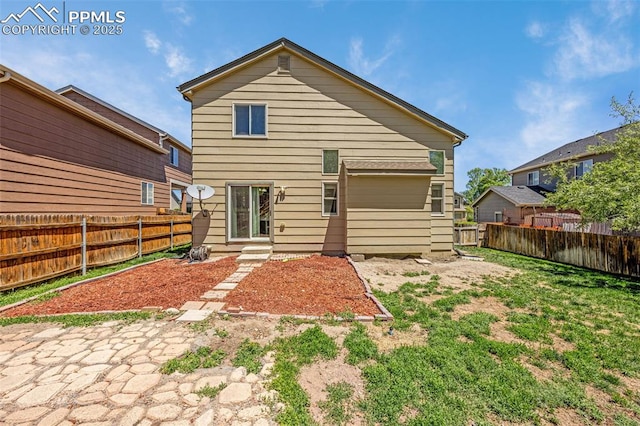 8290 Meadowcrest Dr, Fountain, CO 80817 - rear view of house featuring a fenced backyard and a garage