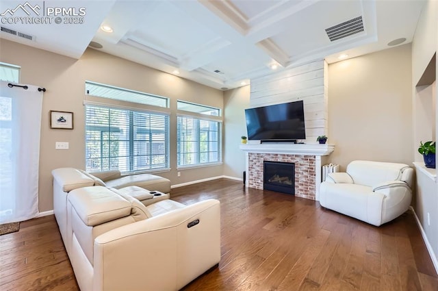 7225 Horizon Wood Ln, Colorado Springs, CO 80927 - living room with wood-type flooring, baseboards, a fireplace, beam ceiling, and coffered ceiling