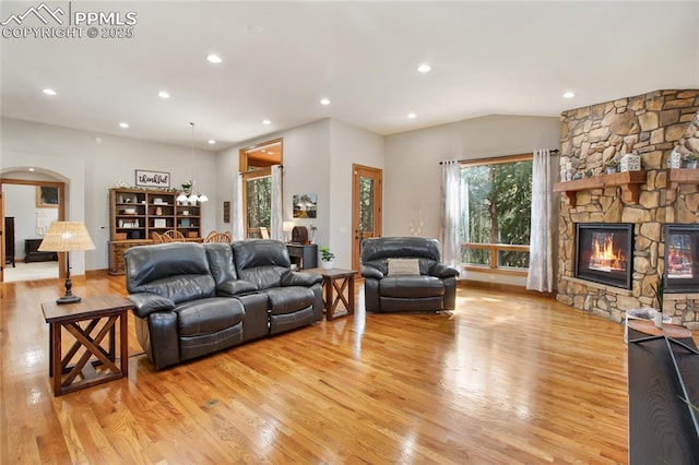 1230 Cottontail Trl, Woodland Park, CO 80863 - living room featuring light wood-style flooring, arched walkways, plenty of natural light, and recessed lighting