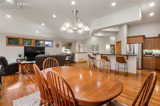 1230 Cottontail Trl, Woodland Park, CO 80863 - dining room with light wood finished floors, recessed lighting, a chandelier, and lofted ceiling