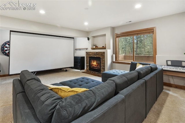 1230 Cottontail Trl, Woodland Park, CO 80863 - cinema featuring light colored carpet, a stone fireplace, recessed lighting, and baseboards