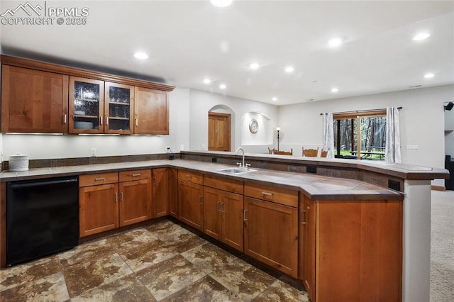 1230 Cottontail Trl, Woodland Park, CO 80863 - kitchen with a peninsula, a sink, arched walkways, recessed lighting, and brown cabinets