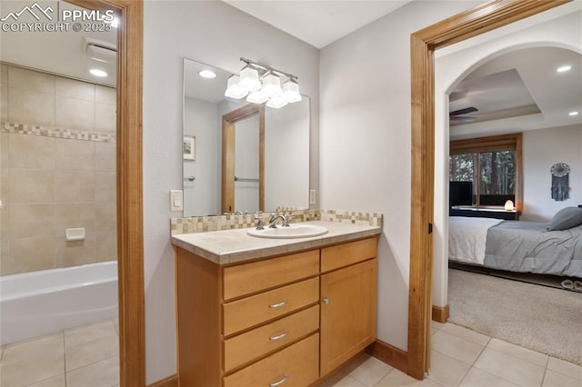 1230 Cottontail Trl, Woodland Park, CO 80863 - ensuite bathroom featuring tile patterned flooring, baseboards, ceiling fan, vanity, and recessed lighting