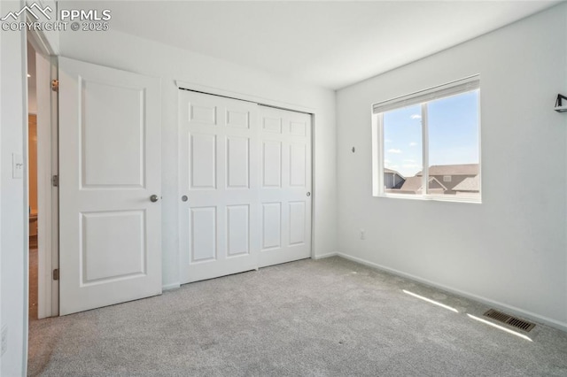 1145 Ibex Dr, Severance, CO 80550 - unfurnished bedroom featuring carpet flooring, a closet, and baseboards