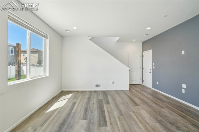 1145 Ibex Dr, Severance, CO 80550 - unfurnished living room with wood finished floors, baseboards, and recessed lighting