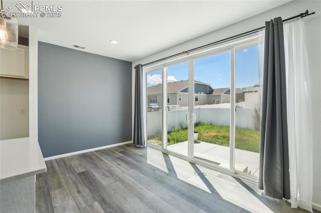 1145 Ibex Dr, Severance, CO 80550 - empty room featuring wood finished floors, recessed lighting, and baseboards