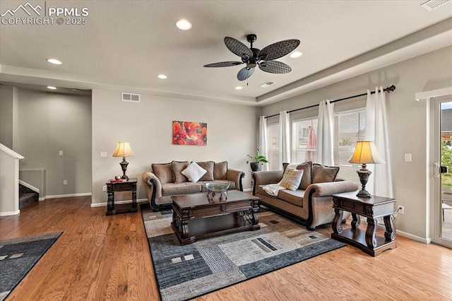 7890 Treehouse Ter, Fountain, CO 80817 - living room featuring wood finished floors, stairs, a ceiling fan, and recessed lighting