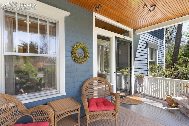 20 W Caramillo St, Colorado Springs, CO 80907 - wooden terrace featuring a porch