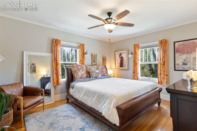 20 W Caramillo St, Colorado Springs, CO 80907 - bedroom featuring ornamental molding, light wood-style flooring, a ceiling fan, and baseboards