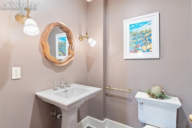 20 W Caramillo St, Colorado Springs, CO 80907 - half bathroom with toilet and a sink