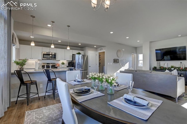 7371 Cornice Pt, Colorado Springs, CO 80923 - dining space with wood finished floors and recessed lighting