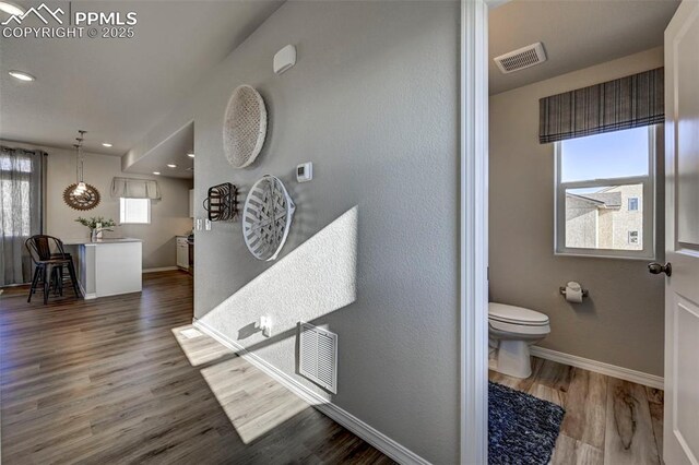 7371 Cornice Pt, Colorado Springs, CO 80923 - bathroom with toilet, baseboards, wood finished floors, and recessed lighting