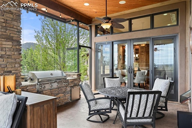 1624 Oakmoor Hts, Colorado Springs, CO 80906 - sunroom / solarium featuring outdoor dining space, an outdoor kitchen, a ceiling fan, and plenty of natural light