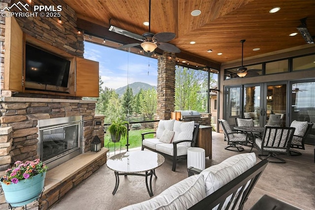 1624 Oakmoor Hts, Colorado Springs, CO 80906 - view of patio featuring an outdoor living space with a fireplace, a ceiling fan, area for grilling, french doors, and outdoor dining space