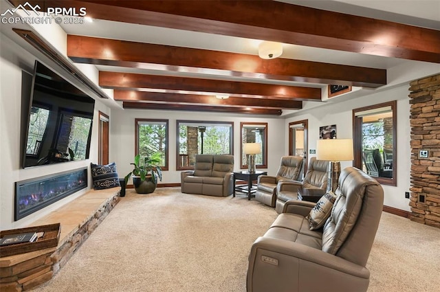 1624 Oakmoor Hts, Colorado Springs, CO 80906 - carpeted living room featuring beam ceiling, a stone fireplace, and baseboards
