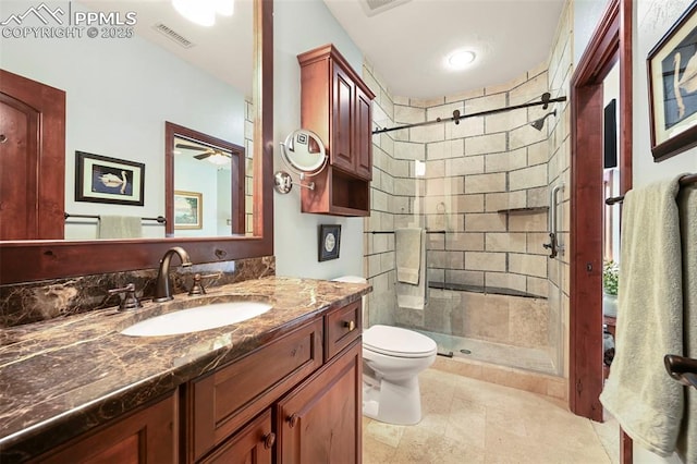 1624 Oakmoor Hts, Colorado Springs, CO 80906 - bathroom with a shower stall, toilet, vanity, and ceiling fan