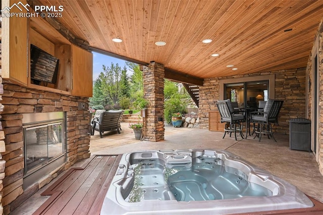 1624 Oakmoor Hts, Colorado Springs, CO 80906 - view of patio / terrace featuring an outdoor stone fireplace and outdoor dining area