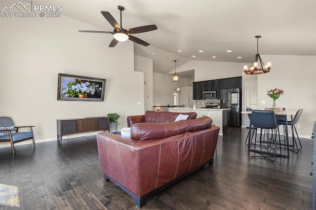 13124 Park Meadows Dr, Peyton, CO 80831 - living area featuring high vaulted ceiling, ceiling fan, a chandelier, recessed lighting, and dark wood finished floors