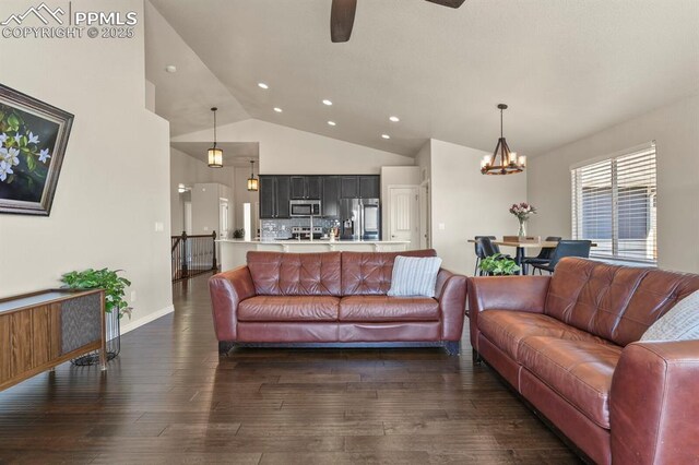13124 Park Meadows Dr, Peyton, CO 80831 - living room featuring dark wood-style floors, recessed lighting, a chandelier, ceiling fan, and high vaulted ceiling