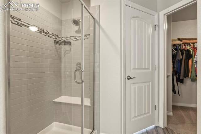 13124 Park Meadows Dr, Peyton, CO 80831 - full bath with a shower stall, a spacious closet, and baseboards