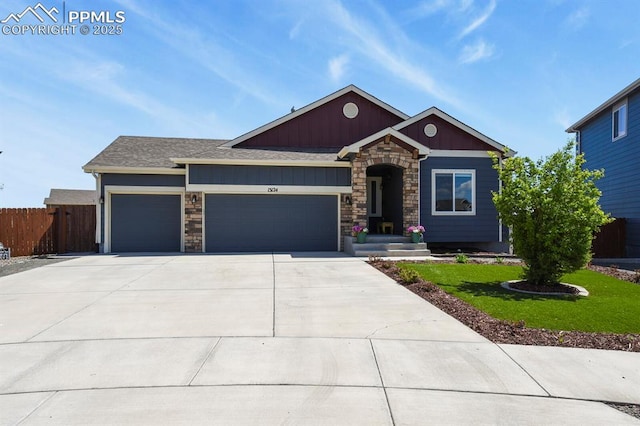 13124 Park Meadows Dr, Peyton, CO 80831 - craftsman-style home featuring a garage, stone siding, concrete driveway, and board and batten siding
