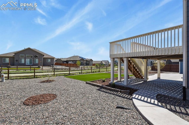 13124 Park Meadows Dr, Peyton, CO 80831 - fenced backyard with a patio area, stairs, a deck, and a residential view