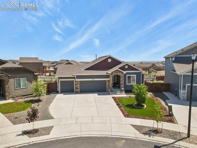 13124 Park Meadows Dr, Peyton, CO 80831 - view of front of property with an attached garage, fence, concrete driveway, and a residential view