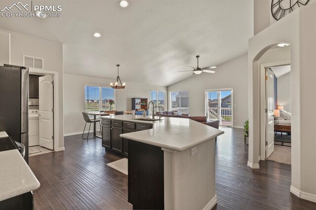 13124 Park Meadows Dr, Peyton, CO 80831 - kitchen featuring a sink, freestanding refrigerator, baseboards, light countertops, and open floor plan