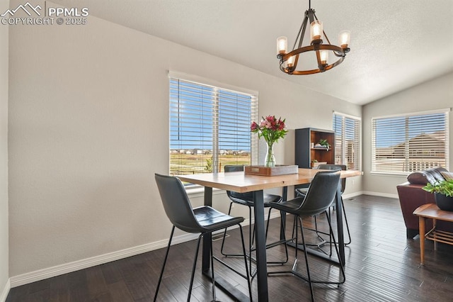 13124 Park Meadows Dr, Peyton, CO 80831 - dining room featuring a chandelier, healthy amount of natural light, baseboards, lofted ceiling, and dark wood-style floors