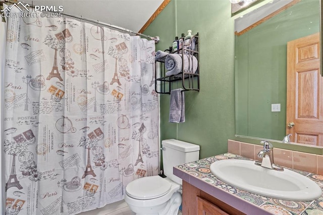 10635 Via Vaquaro Pt, Fountain, CO 80817 - full bathroom featuring toilet, vanity, a shower with shower curtain, and a textured wall